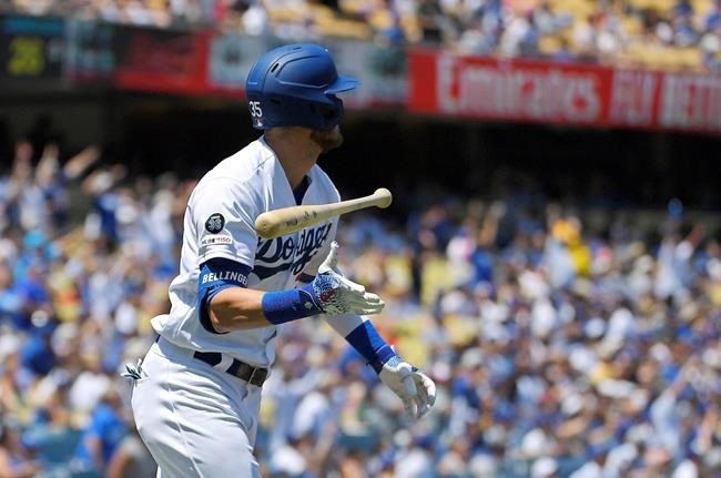 Los Angeles Dodgers' Cody Bellinger tosses his bat as he runs to first base after hitting a solo home run during the first inning of a baseball game against the Arizona Diamondbacks, Sunday, Aug. 11, 2019, in Los Angeles. (AP Photo/Mark J. Terrill)