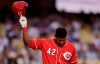 Cincinnati Reds' Yasiel Puig tips his helmet to fans as he comes up to bat during the first inning of a baseball game against the Los Angeles Dodgers, Monday, April 15, 2019, in Los Angeles. (AP Photo/Mark J. Terrill)