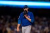 Chicago Cubs starting pitcher Kyle Hendricks walks off the field after being removed from the baseball game against the Los Angeles Dodgers during the fifth inning in Los Angeles, Friday, June 14, 2019. (AP Photo/Kyusung Gong)