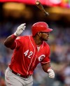 Cincinnati Reds' Yasiel Puig flips his bat after hitting a solo home run during the first inning of a baseball game against the Los Angeles Dodgers, Monday, April 15, 2019, in Los Angeles. (AP Photo/Mark J. Terrill)