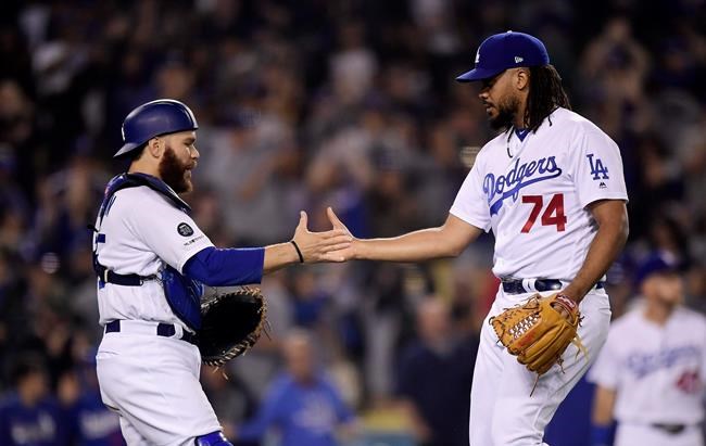 Los Angeles Dodgers catcher Russell Martin, left, and relief pitcher Kenley Jansen congratulate each other after the Dodgers defeated the New York Mets 2-0 in a baseball game Thursday, May 30, 2019, in Los Angeles. (AP Photo/Mark J. Terrill)