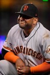 San Francisco Giants third baseman Pablo Sandoval winces after having his hand stepped on while forcing out Los Angeles Dodgers' Max Muncy during the fifth inning of a baseball game, Monday, June 17, 2019, in Los Angeles. (AP Photo/Mark J. Terrill)
