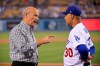 Los Angeles Dodgers co-owner Stan Kasten, left, talks with manager Dave Roberts prior to the team's baseball game against the Colorado Rockies on Friday, Sept. 20, 2019, in Los Angeles. (AP Photo/Mark J. Terrill)
