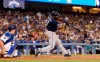 San Diego Padres' Manuel Margot hits a solo home run in front of Los Angeles Dodgers catcher Will Smith during the eighth inning of a baseball game Saturday, Aug. 3, 2019, in Los Angeles. (AP Photo/Mark J. Terrill)