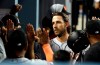 San Francisco Giants' Madison Bumgarner celebrates his two-run home run with teammates in the dugout during the sixth inning of a baseball game against the Los Angeles Dodgers, Tuesday, April 2, 2019, in Los Angeles. (AP Photo/Marcio Jose Sanchez)