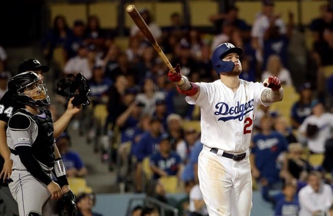 Los Angeles Dodgers' Alex Verdugo watches his game-ending solo home run during the 11th inning of the team's baseball game against the Colorado Rockies on Saturday, June 22, 2019, in Los Angeles. Los Angeles won 5-4. (AP Photo/Marcio Jose Sanchez)