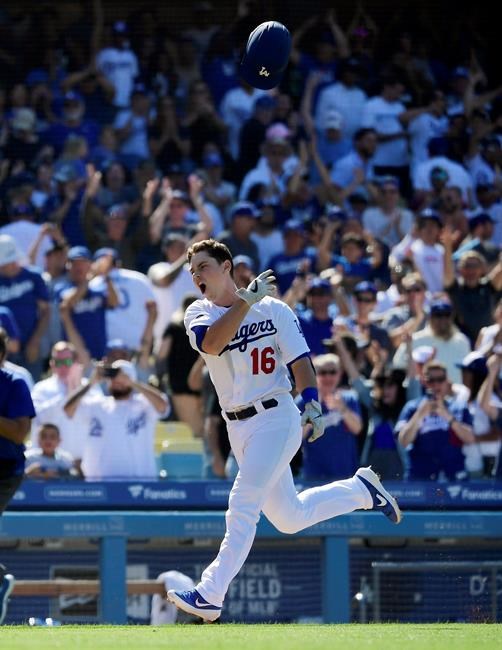 Los Angeles Dodgers' Will Smith tosses his helmet before scoring after hitting a two-run walkoff home run during the ninth inning of a baseball game against the Colorado Rockies, Sunday, June 23, 2019, in Los Angeles. (AP Photo/Mark J. Terrill)