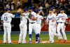 The Los Angeles Dodgers celebrate after a 9-5 win over the New York Mets in a baseball game, Monday, May 27, 2019, in Los Angeles. (AP Photo/Marcio Jose Sanchez)