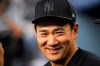 New York Yankees' Masahiro Tanaka, of Japan, smiles in the dugout during the first inning of a baseball game against the Los Angeles Dodgers, Friday, Aug. 23, 2019, in Los Angeles. (AP Photo/Mark J. Terrill)