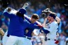 Los Angeles Dodgers' Will Smith, center, has his shirt ripped off by Kenley Jansen, left, and Alex Verdugo after hitting a two-run walkoff home run during the ninth inning of a baseball game against the Colorado Rockies, Sunday, June 23, 2019, in Los Angeles. (AP Photo/Mark J. Terrill)