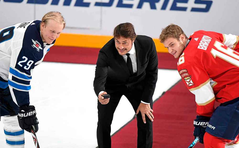 (Martti Kainulainen/Lehtikuva via AP)
Retired NHL star Teemu Selanne drops the puck during a ceremonial faceoff between Patrik Laine, left, of the Winnipeg Jets and Aleksander Barkov of the Florida Panthers prior to the NHL Global Series in Helsinki, Finland on Thursday.