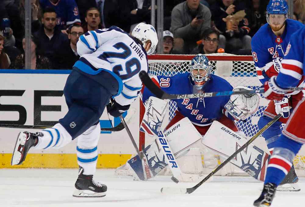 (AP Photo/Kathy Willens)
Winnipeg Jets right wing Patrik Laine (29) of Finland shoots against New York Rangers goalie Henrik Lundqvist of Sweden during the second period of an NHL hockey game in New York, Tuesday, March 6, 2018. Laine had a hat trick as the Jets shut out the Rangers 3-0.