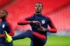 FILE - In this Wednesday, Nov. 14, 2018 file photo, United States national soccer team player Timothy Weah exercises during a training session at Wembley Stadium in London. Tim Weah, a striker for the U.S. national team and the son of former AC Milan star George Weah, has joined Scottish champion Celtic on a six-month loan deal from Paris Saint-Germain, Celtic announced on Monday Jan. 7, 2019. (AP Photo/Tim Ireland, File)