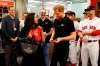 Britain's Prince Harry and Meghan, Duchess of Sussex meet Boston Red Sox players before a match against the New York Yankees in London, Saturday June 29, 2019. (Peter Nicholls/Pool via AP)