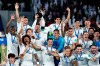 FILE - In this Saturday, Dec. 22, 2018 file photo, Real Madrid players celebrate with the trophy after winning the Club World Cup at Zayed Sport City in Abu Dhabi, United Arab Emirates. FIFA Council members will be asked on Friday March 15, 2019, to approve a pilot of an expanded 24-team Club World Cup in June-July 2021, The Associated Press has learned. A revamp of the current annual December seven-team competition is being pursued by FIFA President Gianni Infantino despite ongoing opposition from Europe, with the long-term vision of the bigger Club World Cup being staged every four years. (AP Photo/Hassan Ammar, File)