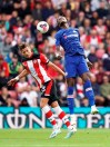 Southampton's Jan Bednarek, left, and Chelsea's Tammy Abraham battle for the ball during the English Premier League soccer match at St Mary's Stadium, Southampton, England, Sunday Oct. 6, 2019. (John Walton/PA via AP)