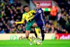 Norwich City's Jamal Lewis, left, and Watford's Gerard Deulofeu battle for the ball during the English Premier League soccer match at Carrow Road, Norwich, England, Friday Nov. 8, 2019. (John Walton/PA via AP)