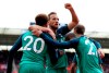 Tottenham Hotspur's Harry Kane, center, celebrates scoring against Southampton during the English Premier League soccer match at St Mary's Stadium, Southampton, England, Saturday March 9, 2019. (Andrew Matthews/PA via AP)
