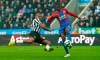 Newcastle United's Salomon Rondon, left, and Crystal Palace's Aaron Wan-Bissaka in action during the English Premier League soccer match at St James' Park, Newcastle, England, Saturday April 6, 2019. (Owen Humphreys/PA via AP)