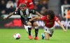 Newcastle United's DeAndre Yedlin, left, and Manchester United's Tahith Chong battle for the ball during the English Premier League soccer match at St James' Park, Newcastle, England, Sunday Oct. 6, 2019. (Owen Humphreys/PA via AP)