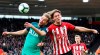 Tottenham Hotspur's Harry Kane, left, and Southampton's Jannik Vestergaard battle for the ball during the English Premier League soccer match at St Mary's Stadium, Southampton, England, Saturday March 9, 2019. (Andrew Matthews/PA via AP)