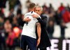 Tottenham Hotspur manager Jose Mourinho embraces Toby Alderweireld after the English Premier League soccer match between Tottenham and West Ham, at the London Stadium, Saturday, Nov. 23, 2019. (John Walton/PA via AP)