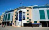 People walks past Stamford Bridge, London, Friday June 28, 2019. Frank Lampard has returned to Chelsea as the club‚Äôs 12th manager in 16 years under Roman Abramovich‚Äôs ownership. The former Chelsea midfielder has left second-tier club Derby, where he spent he came close to securing promotion to the Premier League in his first season in management. (Adam Davy/PA via AP)