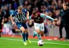 Aston Villa's Trezeguet and Brighton and Hove Albion's Adam Webster, left, battle for the ball during the Premier League soccer match between Aston Villa and Brighton and Hove Albion, at Villa Park, Birmingham, England, Saturday, Oct. 19, 2019. (Nick Potts/PA via AP)