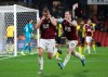 Burnley's James Tarkowski (left) celebrates scoring his side's third goal during the English Premier League soccer match between Burnley and Watford, at Vicarage Road, Watford, England, Saturday, Nov. 23, 2019. (Nigel French/PA via AP)