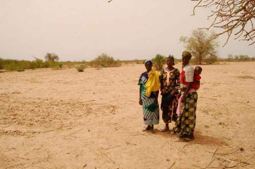 Emily Cain for the Winnipeg Free Press
'The hunger is one of the worst sicknesses you can have. If you are hungry, you cannot produce anything,' mother of seven Yapoa Lalé said through a translator, sitting on chalk-coloured, bone-dry soil below the shade of a tree. Pictured: Yapoa Lale (right) with daughter Martine in Tamfanou, Niger.