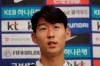 South Korean national soccer team player Son Heung-min answers a reporter's question upon his arrival after the soccer match against North Korea, at Incheon International Airport in Incheon, South Korea, Thursday, Oct. 17, 2019. North Korea held South Korea to a 0-0 draw Tuesday in a World Cup qualifying soccer match played in an empty stadium in Pyongyang, but specific details of the game weren't immediately available. South Korean soccer officials were unable to watch a telecast of the historic game at Kim Il Sung Stadium and South Korean spectators and media were denied entry. (AP Photo/Lee Jin-man)