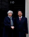 Britain's Prime Minister Theresa May welcomes Japan's Prime Minister Shinzo Abe to Downing Street in London, Thursday, Jan. 10, 2019. (AP Photo/Kirsty Wigglesworth)