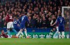 Chelsea's Eden Hazard, third left, scores his sides first goal during the English Premier League soccer match between Chelsea and West Ham at Stamford Bridge stadium in London, Monday, April 8, 2019. (AP Photo/Alastair Grant)