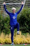 US player Megan Rapinoe stretches during a US womens soccer team training session at the Tottenham Hotspur training centre in London, Thursday, June 6, 2019. The Women's World Cup starts in France on June 7. (AP Photo/Kirsty Wigglesworth)
