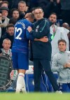 Chelsea's manager Maurizio Sarri hugs Chelsea's Ruben Loftus-Cheek as he comes off during the English Premier League soccer match between Chelsea and West Ham at Stamford Bridge stadium in London, Monday, April 8, 2019. (AP Photo/Alastair Grant)
