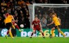 Wolverhampton's Ruben Neves, left, scores his sides second goal during the English FA Cup third round soccer match between Wolverhampton Wanderers and Liverpool at the Molineux Stadium in Wolverhampton, England, Monday, Jan. 7, 2019. (AP Photo/Rui Vieira)