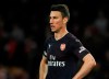 FILE - In this Wednesday, April 24, 2019 file photo, Arsenal's Laurent Koscielny looks on during their English Premier League soccer match againsy Wolverhampton Wanderers at the Molineux Stadium in Wolverhampton, England. Arsenal says captain Laurent Koscielny has refused to travel with the team for its preseason tour to the United States, it was announced Thursday, July 11. The Premier League club released a statement saying it was “very disappointed by Laurent’s actions, which are against our clear instructions.” Arsenal says it was working to resolve the matter. (AP Photo/Rui Vieira, file)