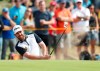 FILE - In this Saturday July 21, 2018 file photo, Louis Oosthuizen of South Africa plays out of a bunker on the 8th hole during the third round of the British Open Golf Championship in Carnoustie, Scotland. Louis Oosthuizen, the 2010 British Open champion, led the South African Open by a shot after a 9-under 62 in the first round on Thursday, Dec. 6. Oosthuizen, playing his home Open for the first time in eight years, made a brilliant start at Randburg Golf Club in Johannesburg with nine birdies, including six in an eight-hole surge on the back nine, and no bogeys. (AP Photo/Alastair Grant, file)