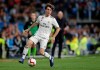 FILE - In this Sunday, March 31, 2019 file photo, Real Madrid's Alvaro Odriozola runs with the ball during their Spanish La Liga soccer match against Huesca at the Santiago Bernabeu stadium in Madrid. Real Madrid right back Alvaro Odriozola has fractured his shoulder and is expected to miss the rest of the season. Madrid says Odriozola broke his left clavicle in the team‚Äôs practice session on Friday, April 19. (AP Photo/Bernat Armangue, file)