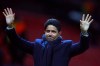 FILE - In this Tuesday, Feb. 12, 2019 file photo, Paris Saint Germain owner Nasser bin Ghanim Al-Khelaifi waves to teams fans at the end of their soccer match against Manchester United at Old Trafford stadium in Manchester, England. Under investigation in French and Swiss criminal investigations, the president of PSG has been praised as a “tremendous professional” by his UEFA executive committee colleague Andrea Agnelli on Tuesday, Sept. 10. Nasser Al-Khelaifi and European Club Association chairman Agnelli have four-year terms to represent clubs on the European soccer body’s ruling panel. (AP Photo/Dave Thompson, file)