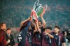 FILE - In this Wednesday, May 24, 1995 file photo, Ajax players Clarence Seedorf, left, Frank Rijkaard, center, and Edgar Davids, right, hold the Champions League European Cup Trophy Aloft as they celebrate their 1-0 victory over AC Milan in Vienna. Ajax is a team that many soccer fans around the world just love to love, especially when they win with flair in a competition like the Champions League. Their victory against Juventus on Tuesday, April 16 - coming only a few weeks after the team eliminated three-time defending champion Real Madrid in the last 16 - put Ajax through to the semifinals 3-2 on aggregate. They will next face either Manchester City or Tottenham. (AP Photo/Luca Bruno, file)