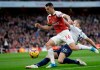 FILE - In this Sunday Dec. 2, 2018 file photo, Arsenal's Granit Xhaka, left, fights for the ball with Tottenham's Eric Dier during their English Premier League soccer match at the Emirates Stadium in London. Arsenal manager Unai Emery says Granit Xhaka might play against Southampton on Saturday, Nov. 23, 2019 after missing the last four games following his angry reaction to being jeered by the team’s own fans. Xhaka was stripped of the captaincy after swearing at heckling Arsenal supporters following his substitution in a 2-2 draw against Crystal Palace at Emirates Stadium. (AP Photo/Tim Ireland, file)