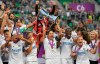 FILE - In this Saturday, May 18, 2019 file photo, Olympique Lyon players celebrate with the trophy after they defeated FC Barcelona 4-1 in the women's soccer Champions League final match at the Groupama Arena in Budapest, Hungary. Four-time defending champion Lyon has been drawn to play Fortuna Hjørring in the round of 16 of the Women's Champions League, it was announced Monday, Sept. 30, 2019. Fortuna Hjorring was the beaten finalist in the 2003 edition of UEFA's continental championship. (Tibor Illyes/MTI via AP, file)