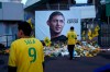 FILE - In this Wednesday, Jan. 30, 2019 file photo, Nantes soccer team supporters stand by a poster of Argentinian player Emiliano Sala and reading 