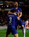 Chelsea's Olivier Giroud, right, celebrates after teammate Marcos Alonso, left, scored his side's first goal of the game during the UEFA Europa League quarterfinal soccer match between Slavia Prague and Chelsea at the Sinobo stadium in Prague, Czech Republic, Thursday, April 11, 2019. (AP Photo/Petr David Josek)
