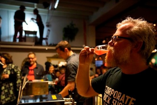 In this photo taken on Saturday, Feb. 23, 2019, brewer Sigurdur Snorrason drinks a craft beer at a festival in Reykjavik. Icelanders are celebrating the end, three decades ago, of a sobering dry spell in their country‚Äôs history. On Friday, March 1 the country toasts the anniversary of the lifting of a decades-long ban on beer with _ what else? _ a nationwide Beer Day. (AP Photo/Egill Bjarnason)