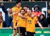 Wolverhampton Wanderers' Diogo Jota, right, celebrates with teammates scoring his side's first goal of the game during the English Premier League soccer match between Wolverhampton Wanderers and Leicester at Molineux, Wolverhampton, England, Saturday, Jan. 19, 2019. (Mike Egerton/PA via AP)