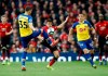 Southampton's Jan Bednarek, left, and Manchester United's Alexis Sanchez battle for the ball during their English Premier League soccer match at Old Trafford, Manchester, England, Saturday, March 2, 2019. (Martin Rickett/PA via AP)