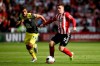 Southampton's Sofiane Boufal, left, and Sheffield United's John Fleck battle for the ball during their English Premier League soccer match at Bramall Lane, Sheffield, England, Saturday, Sept. 14, 2019. (Tim Goode/PA via AP)