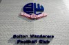 FILE - This Aug. 11, 2018 file photo shows a general view of Bolton Wanderers football stadium in Bolton, England. The days of Youri Djorkaeff, Jay-Jay Okocha and Fernando Hierro running out to play Premier League games for Bolton Wanderers must seem like a lifetime ago for long-suffering fans of the English soccer team. Bolton officials are due in the High Court in central London Wednesday, April 3, 2019 over an unpaid tax bill of 1.2 million pounds ($1.6 million) and other debts. Its players are on strike over unpaid wages and the team is on the verge of relegation to the third tier. (Clint Hughes/PA via AP, file)